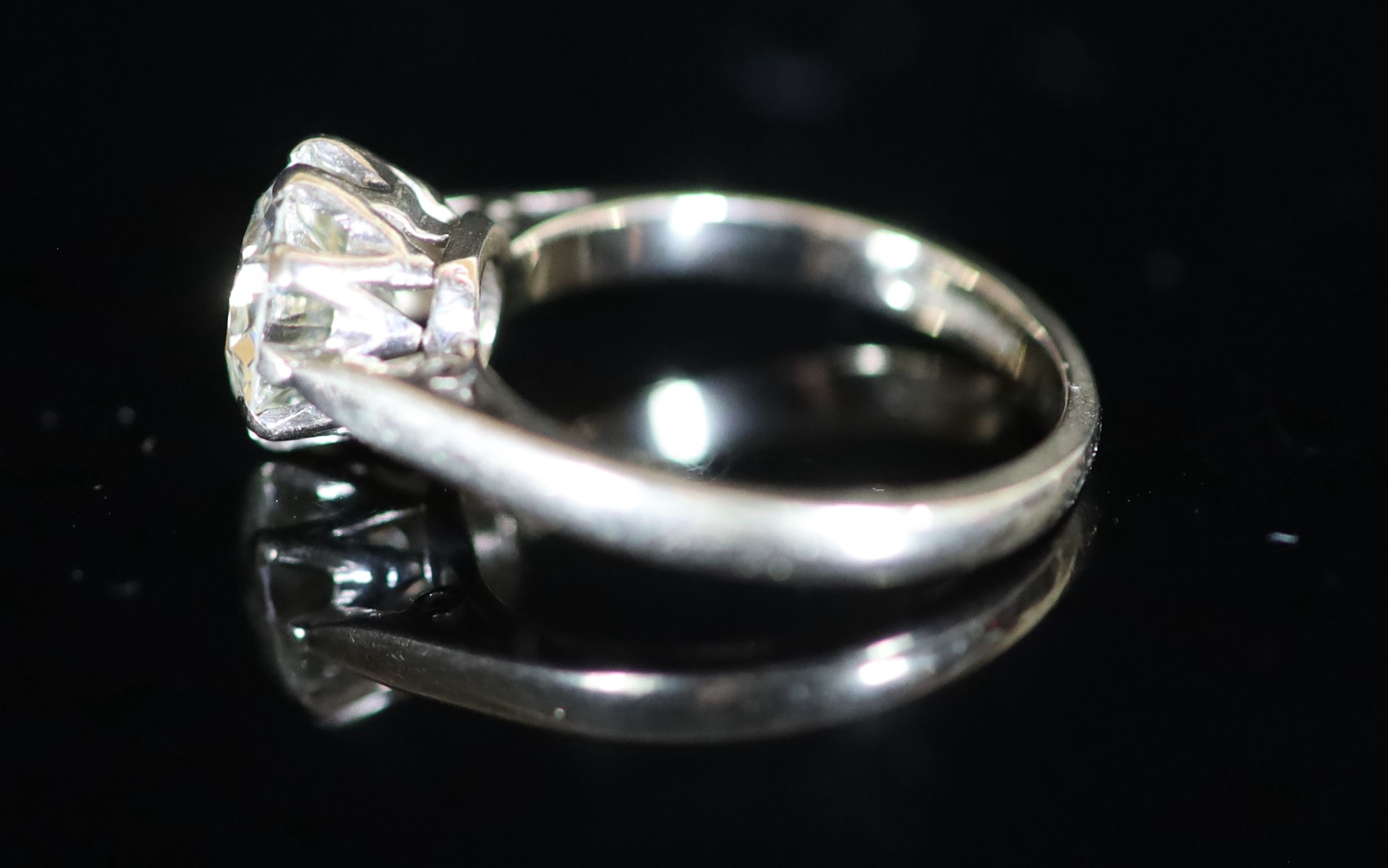 A modern 18ct white gold and solitaire diamond ring